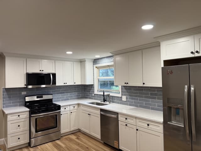 Kitchen with gray subway tile backsplash by Benco Remodeling