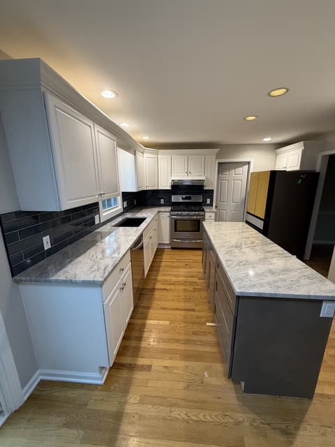Kitchen island with marble-look countertop installed by Benco Remodeling